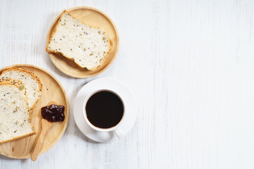 cup of black coffee with bread
