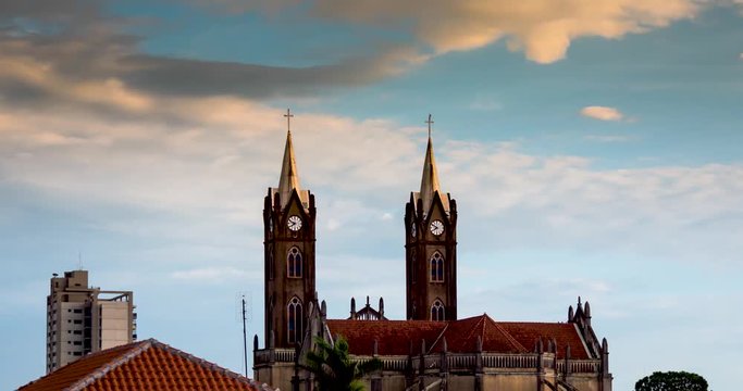 Timelapse with clouds and a church in the afternoon in a city in Brazil's contryside