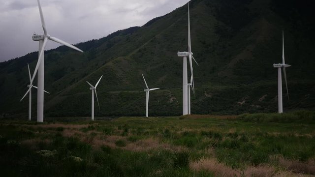 Spinning wind farm turbines 4k