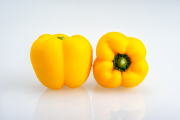 Fresh yellow bell pepper isolated on white background.