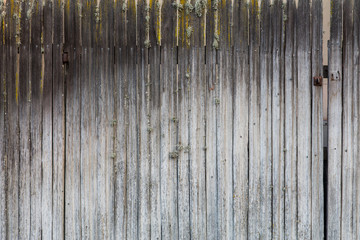 An old wood fence faded by years of exposure to the sun