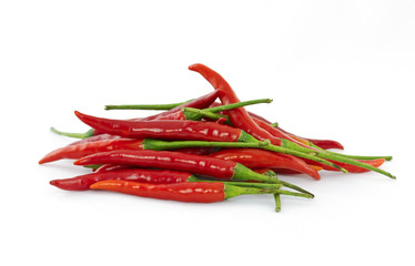 Heap of red hot chili peppers isolated on white background