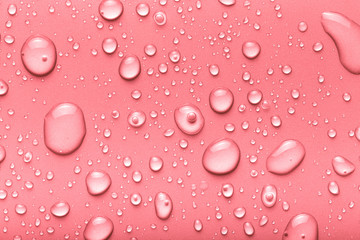 Drops of water on a color background. Pink. Toned