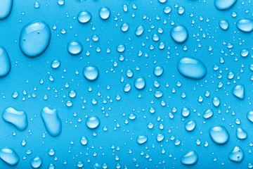 Drops of water on a color background. Blue. Toned - 212717957