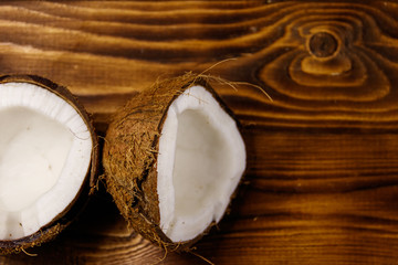 Obraz na płótnie Canvas Fresh ripe coconut on rustic wooden table
