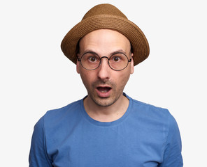 amazed man wearing eyeglasses and hat