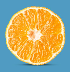 slice of mandarin isolated on blue