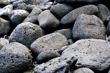 Reunion island seascape, landscape. Black sand, volcanic rocks.