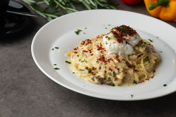 Pasta carbonara and poach egg and chicken