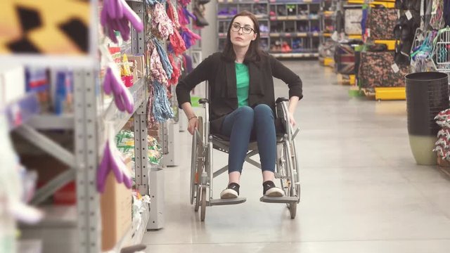 Portrait of a woman with a disability wearing in a wheelchair in the Mall