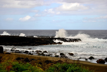 Reunion island seascape, landscape. Black sand, volcanic rocks.