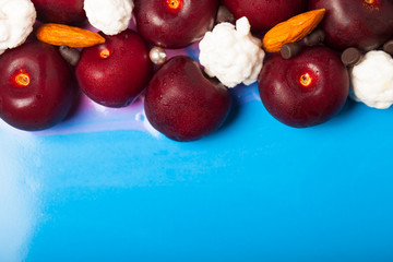 Fresh berries and almond on glazed cake. Selective focus. Shallow depth of field