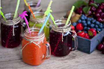 Homemade antioxidant summer fruits smoothie, berry juice assortment