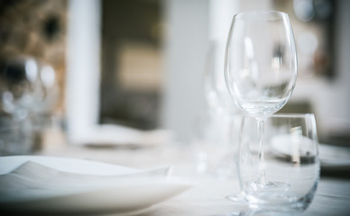 Glasses on a restaurant table. Very shallow depth of field