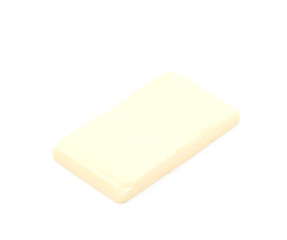 Slice block of butter isolated
