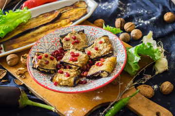 Pkhali with eggplant, walnuts, pomegranate grains. Traditional Georgian food cold appetizer. Vegan vegetarian healthy food.