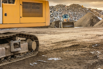 Excavator moving stone in an open pit mine in Spain