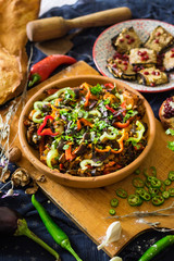 Ajapsandal vegetables stew in clay ketsi dish. Traditional Georgian food made cooked with different sorts of seasonal vegetables and greens (meat as option). Caucasus lunch with eggplant walnut pkhali