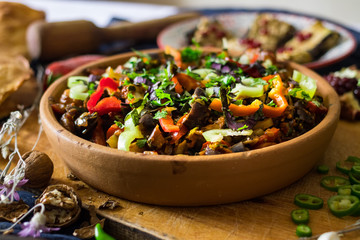 Ajapsandal vegetables stew in clay ketsi dish. Traditional Georgian food made cooked with different...