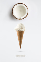 Coconut ice cream flavor in cones with fresh coconut setup on white background . Summer and Sweet menu concept.