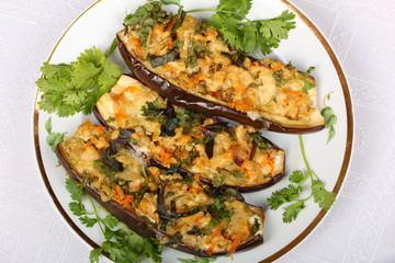 Stuffed eggplant with meat and vegetables with cheese, baked in the oven. Top view