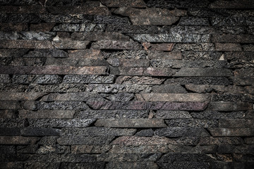 Wall built of natural stone. Toned