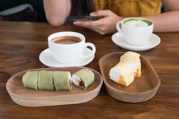 Hot Coffee and Matcha Green Tea On Wooden Table.