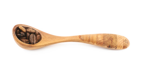 Spoon of coffee beans isolated