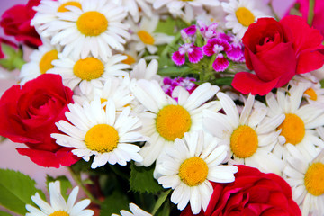 Fototapeta premium Bouquet of white chamomiles red roses red dianthus barbatus. Delicate present