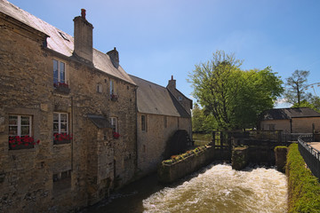 Water mill and Aure River in the old city in Bayeux. Calvados department of Normandy, France © evgenij84