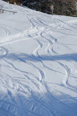 Fototapeta na wymiar Snow traces at ski resort
