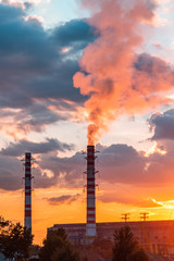Thermal power plant at dusk. Smoking stack of the thermal power station