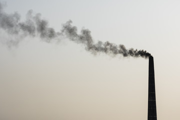 Smoking chimney of a brick factory in Bangladesh