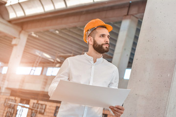 Portrait of an architect at work in a construction site