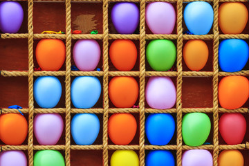 colored balls and target shelf with rope
