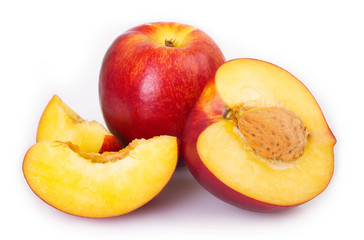Fresh peaches on white background