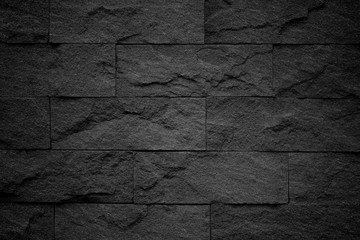 Naklejka premium Dark grey black slate background or natural stone texture.