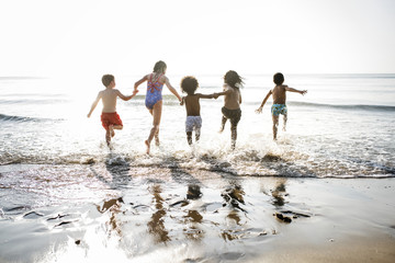 Kids running at the beach