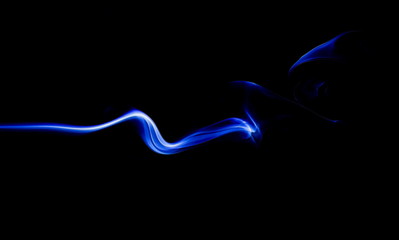 Blue smoke on black background
