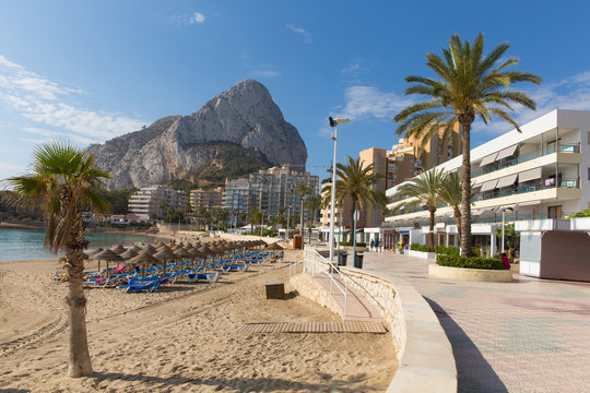 Calp Spain Costa Blanca La Fossa levante playa with rock landmark Pe&ntilde;&oacute;n de Ifach