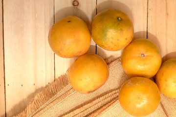 Oranges on rustic wooden table