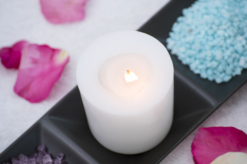 Obraz na płótnie Canvas Spa accessories aromatic candle, flower, salt scrub.