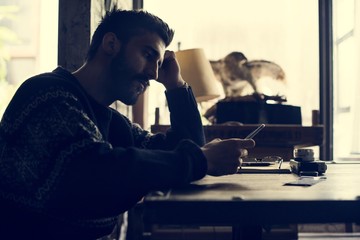 A man holding using smartphone