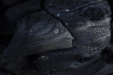 burned wood. black wood from the fire. rings on wood. ash. wood burnt on coal