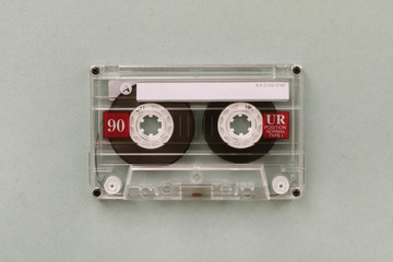 Audio cassette - analogue audio storage media. Audio cassette on gray background