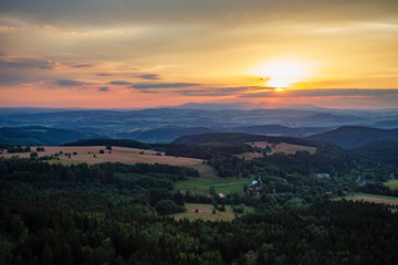 Summer sunset landscape green forest and mountains