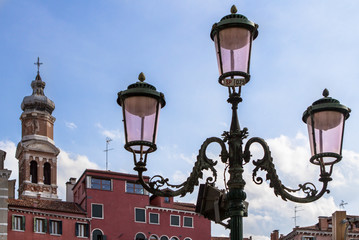 Fototapeta na wymiar Street lamp and old hotel In Venice