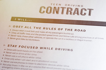 Teen driving contract. Legal contract signing - between parents and their children.