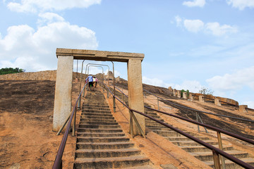 Gateway and rock cut steps leading to the Gomateshwara temple, Vindhyagiri Hill, Shravanbelgola,...