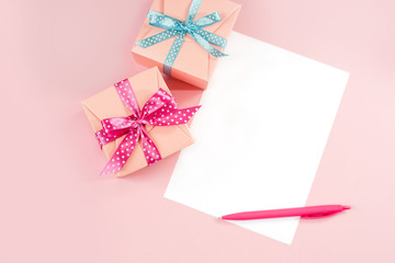 Decorated boxes and blank white sheet of paper.